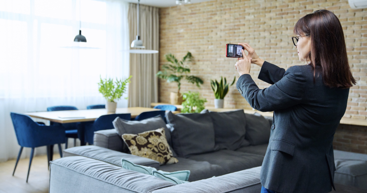 Realtor filming a property with a smartphone